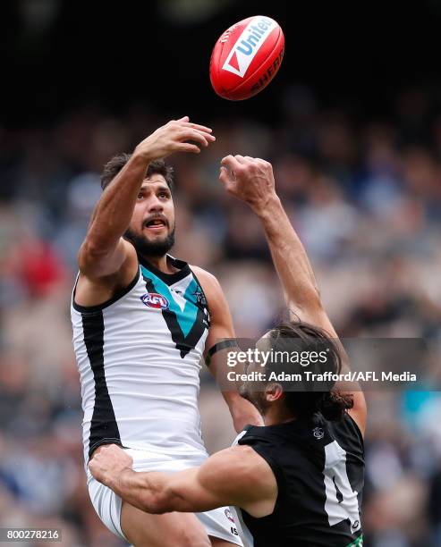 Paddy Ryder of the Power playing his 200th game and Brodie Grundy of the Magpies compete in a ruck contest during the 2017 AFL round 14 match between...