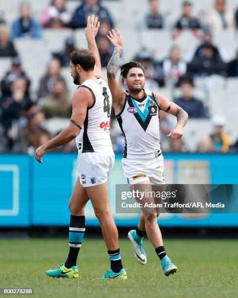 Chad Wingard of the Power celebrates a goal with Paddy Ryder of the Power during the 2017 AFL round 14 match between the Collingwood Magpies and the...