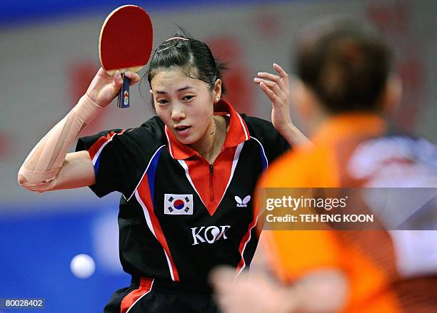 South Korea's Kwak Bangbang returns a shot against Netherland's Li Jie during the World Team Table Tennis Championship in Guangzhou, China's...