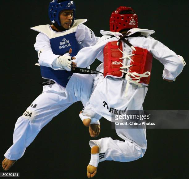 Osornio Erick of Mexico fights with Tazegul Servet of Turkey during men's 68kg final of the "Good Luck Beijing" 2008 International Taekwondo...