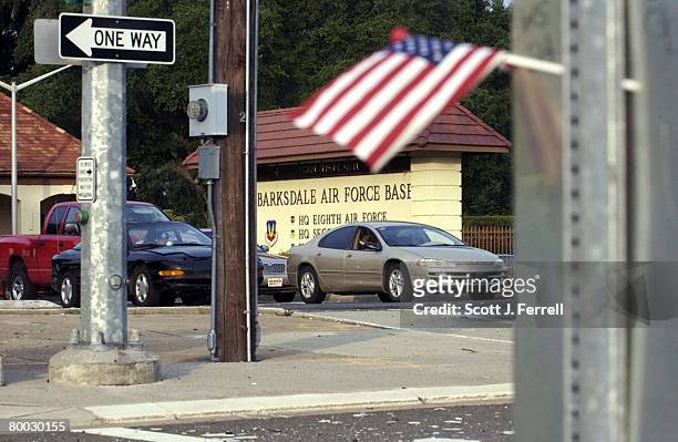 Drivers wait for the light to change as they exit Barksdale Air Force Base in Bossier City. The base, begun in the 1930's, houses B-52 aircraft, and...