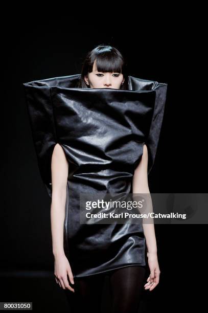 Model walks the runway wearing Maison Martin Margiela at the Fall/Winter 2008/2009 collection during Paris Fashion Week on the 25th of February 2008...