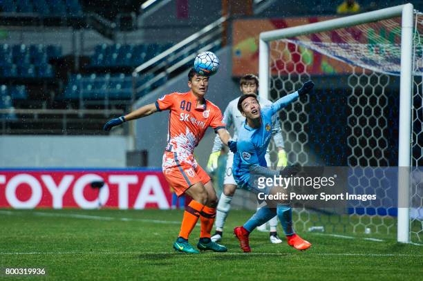 Jiangsu FC Defender Hong Jeongho fights for the ball with Jeju United FC Midfielder Lee Chandong during the AFC Champions League 2017 Group H match...