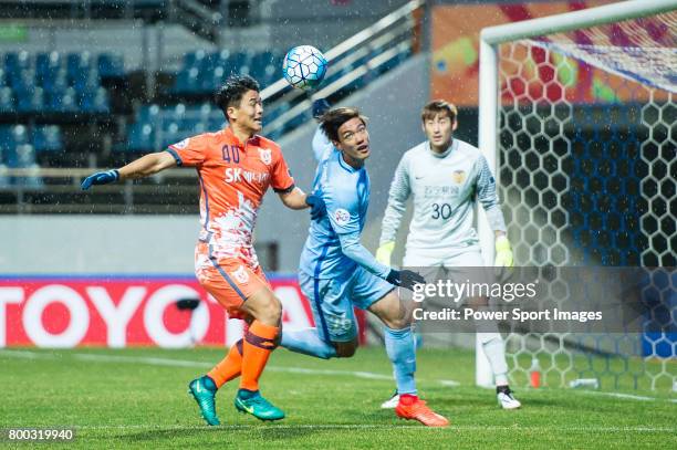 Jiangsu FC Defender Hong Jeongho fights for the ball with Jeju United FC Midfielder Lee Chandong during the AFC Champions League 2017 Group H match...