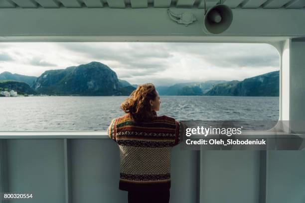 woman looking at scenic view from ferry - passenger ferry stock pictures, royalty-free photos & images