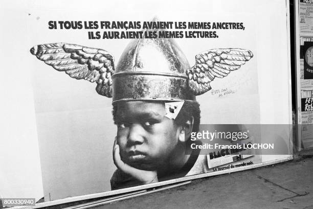 An advertisement for Black Hebdo magazine featuring a Black child reluctantly wearing an ancient Gallic helmet, Paris, May 1976. The slogan reads "If...