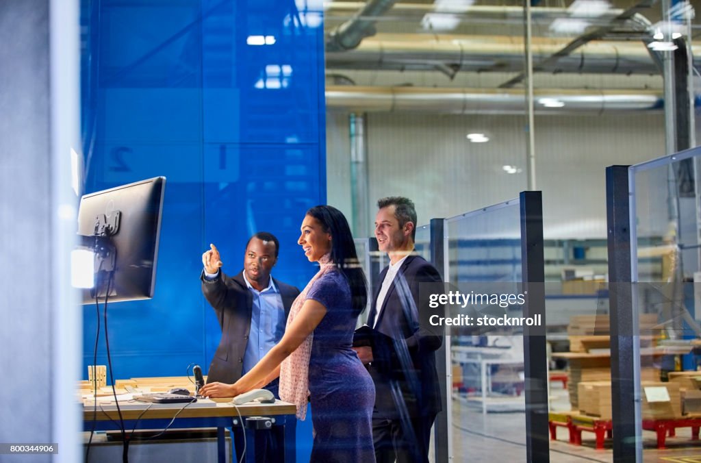 Quality assurance team working in factory