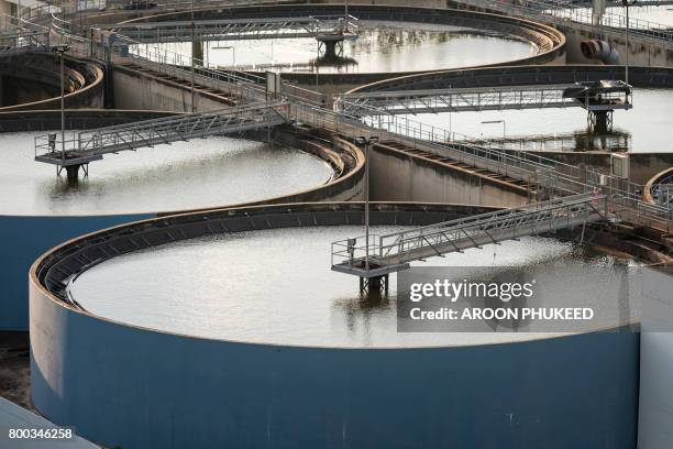 sludge treatment pool and storage tanks - réservoir de stockage photos et images de collection