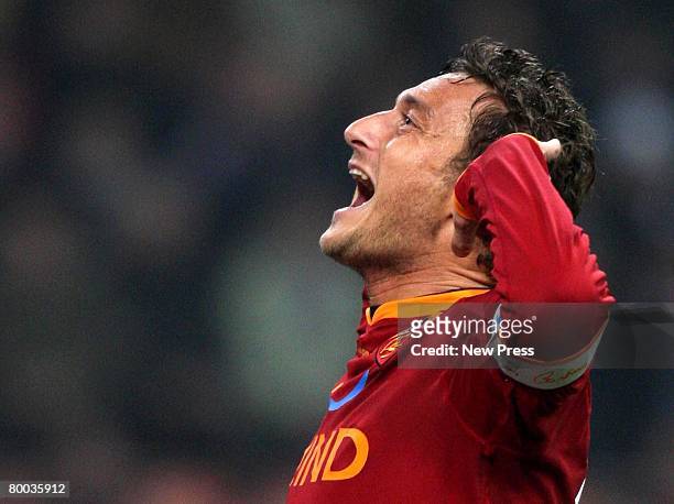 Francesco Totti of Roma celebrates a goal during the Serie A match between Inter and Roma at the Stadio Meazza San Siro on February 27, 2008 in...