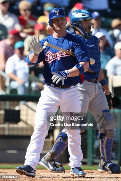 Hank Blalock of the Texas Rangers walks back to the dugout during the game against the Kansas City Royals during a preseason game at Surprise Stadium...