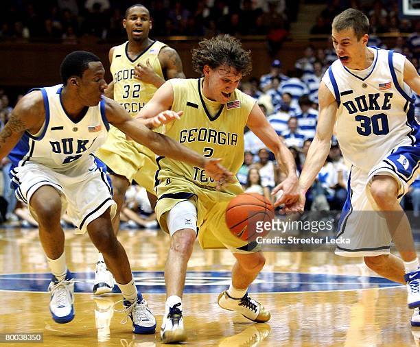 Matt Causey of the Georgia Tech Yellow Jackets tries to keep the ball away from teammates Nolan Smith and Jon Scheyer of the Duke Blue Devils during...