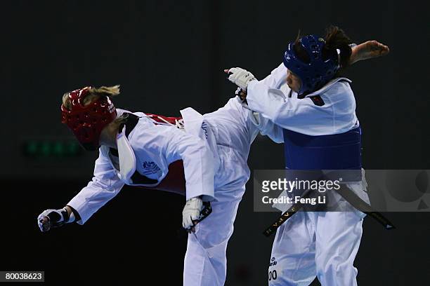 Japan's Yoriko Okamoto competes against Australia's Tina Morgan during the women's under 67kg of the 'Good Luck Beijing' 2008 International Taekwondo...