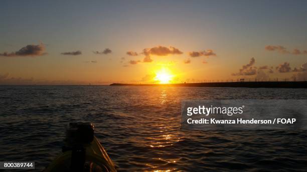sunset over sea - kwanza imagens e fotografias de stock