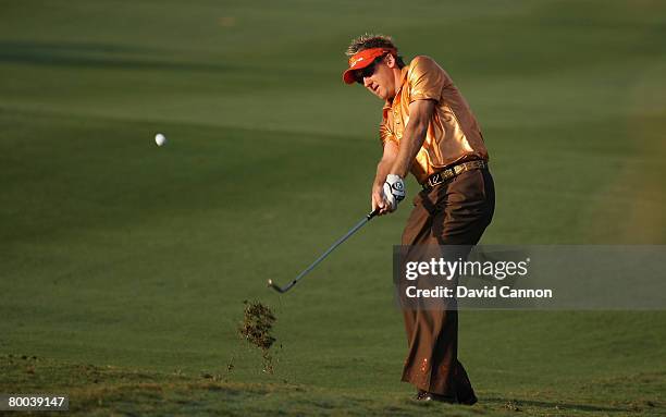 Ian Poulter of England hits his second shot at the 10th hole during the first round of the 2008 Johnnie Walker Classic held at The DLF Golf and...