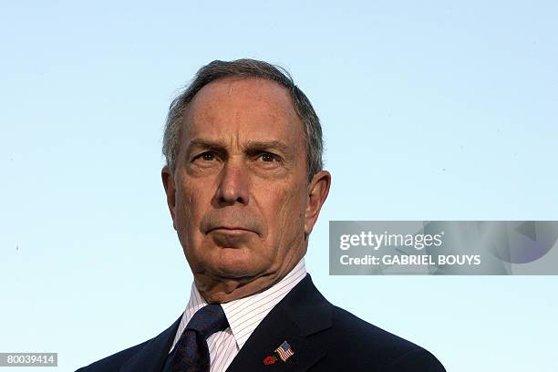 This January 19, 2008 file photo shows New York City Mayor Michael Bloomberg listening as California Governor Arnold Schwarzenegger speaks during a...