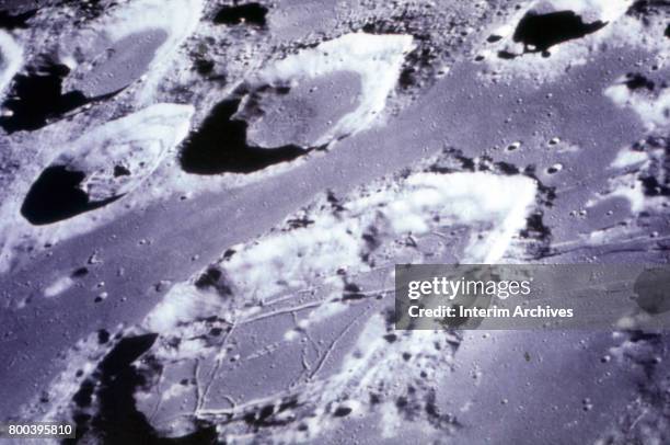 View of craters on the suface of the Moon, taken during NASA's Apollo 8 mission, December 1968. Among those pictured are the Crater of Goelenious ,...