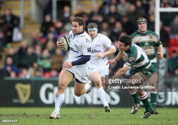 Luke McAlister of Sale breaks out from the Leicester Tigers during the Guinness Premiership match between Leicester Tigers and Sale Sharks at Welford...