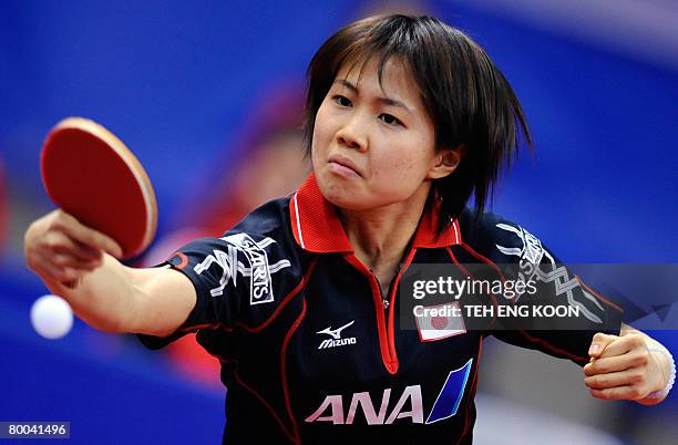 Japan's Hirano Sayaka returns a shot against Hungary's Georgina Pota during the women's quarter final round of the World Team Table Tennis...