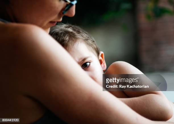 baby boy in mothers arms - dia bildbanksfoton och bilder