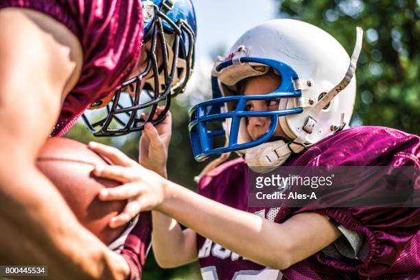 kids in sport - football player face stock pictures, royalty-free photos & images