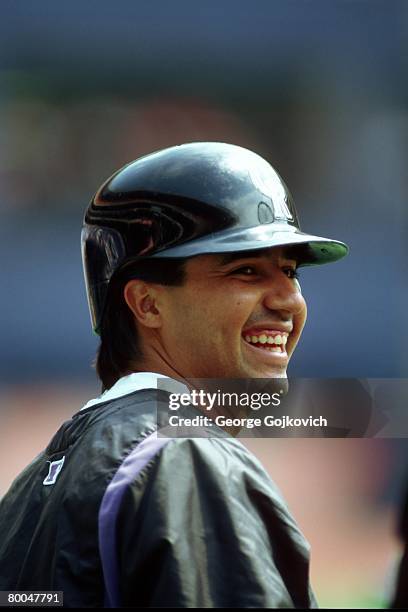 Third baseman Vinny Castilla of the Colorado Rockies smiles while watching batting practice before a game against the Pittsburgh Pirates at Three...