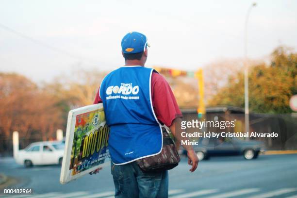 bold colours - lottery vendor - unhappy salesman stock pictures, royalty-free photos & images