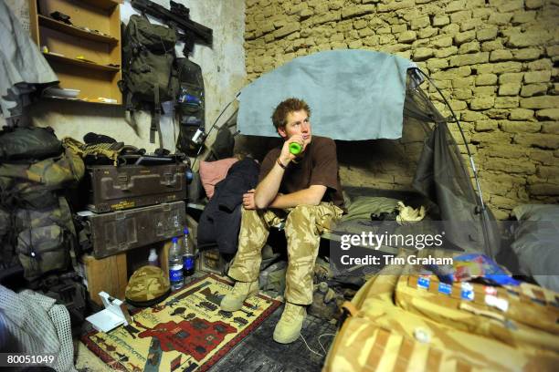 Prince Harry sits on his camp bed in his accommodation at FOB Delhi ,on January 2, 2008 in Helmand province, Southern Afghanistan.