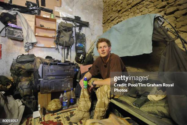 Prince Harry sits on his camp bed in his accommodation at FOB Delhi ,on January 2, 2008 in Helmand province, Southern Afghanistan.