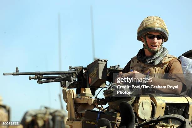 Prince Harry sits in his position on a Spartan armoured vehicle on February 18, 2008 in Helmand province, Southern Afghanistan.