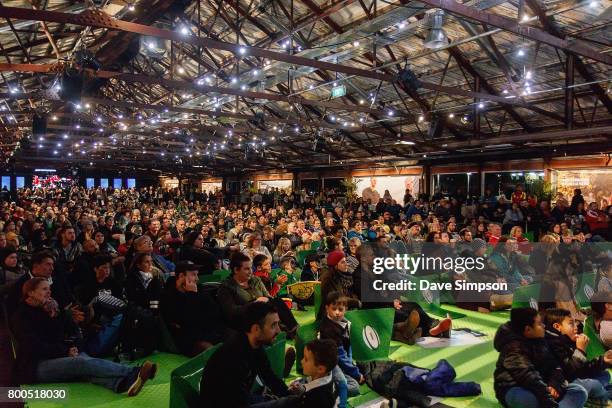 New Zealand All Black fans and British & Irish Lions fans at the Queens Wharf Auckland Fan Zone watch the Rugby Test match between the New Zealand...