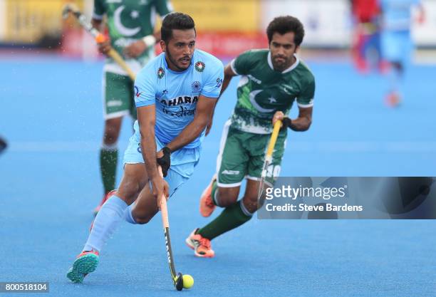 Harmanpreet Singh of India runs with the ball during the 5th-8th place match between Pakistan and India on day eight of the Hero Hockey World League...