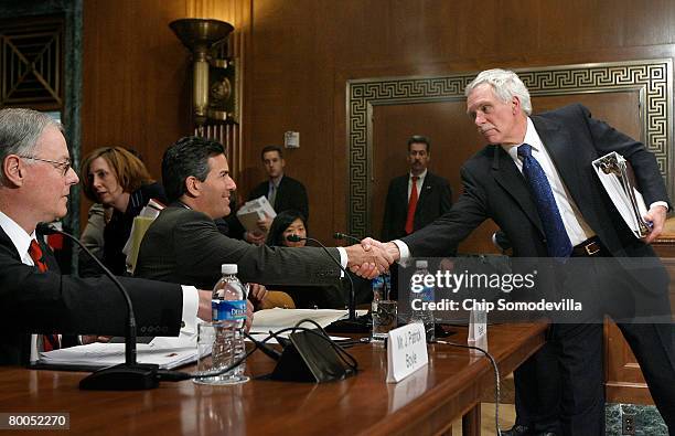 Agriculture Secretary Ed Schafer greets Human Society President and CEO Wayne Pacelle before he and American Meat Institute Foundation President and...