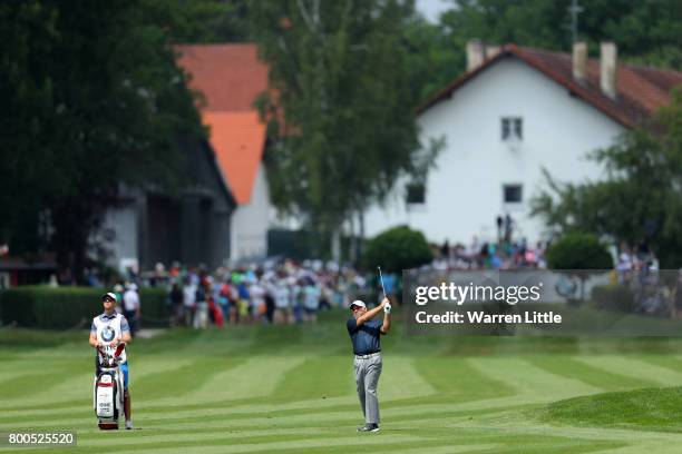 Hennie Otto of South Africa hits his second shot on the 1st hole during day three of the BMW International Open at Golfclub Munchen Eichenried on...