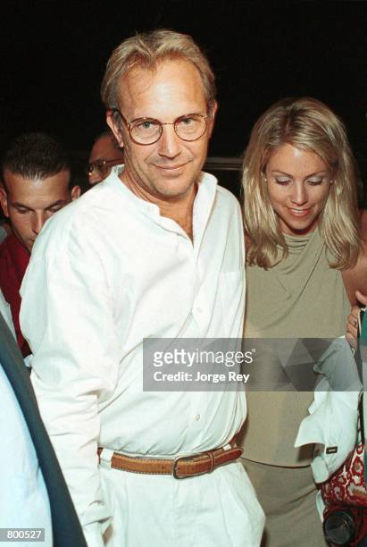 Actor Kevin Costner and his girlfriend Christine Baumgarter arrive at the Chaplin Theater April 11, 2001 in Havana, Cuba for a screening of his film...