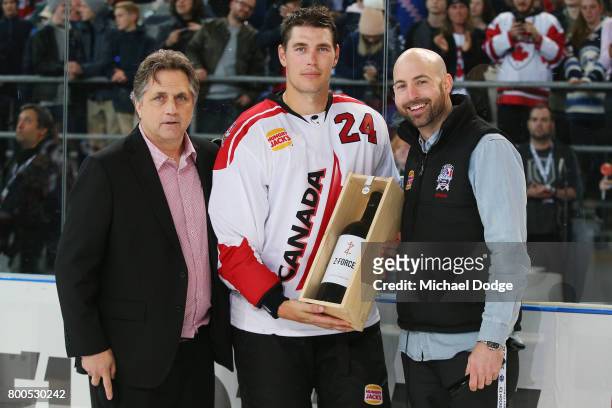 Adam Cracknell of Canada poses after receiving best Canada player during the Ice Hockey Classic match between the United States of America and Canada...
