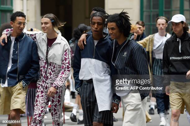 Models present creations by Andrea Crews house during men's Fashion Week for the Spring/Summer 2017/2018 collection in Paris on June 24, 2017. / AFP...