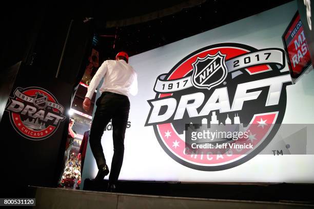 Michael Rasmussen, ninth overall pick of the Detroit Red Wings, makes his way to the stage during Round One of the 2017 NHL Draft at United Center on...