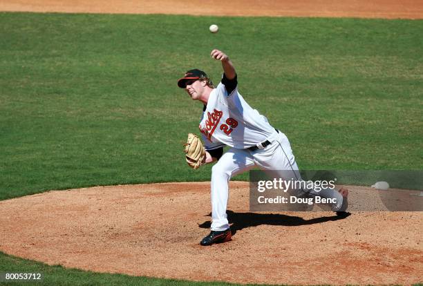 Starting pitcher Adam Loewen of the Baltimore Orioles pitches against the Florida Marlins at Fort Lauderdale Stadium February 28, 2008 in Fort...