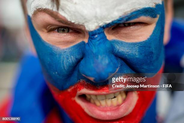 Russia fan poses for a photo ahead of the FIFA Confederations Cup Russia 2017 group A football match between Mexico and Russia at Kazan Arena on June...
