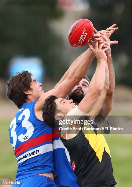 Kieran Collins and Lewis Young of the Bulldogs compete for the ball during the 2017 VFL round 10 match between the Footscray Bulldogs and the...