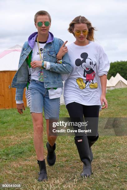 Cara Delevingne and Margot Robbie attend day two of Glastonbury on June 24, 2017 in Glastonbury, England.