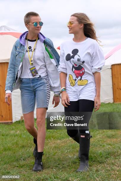 Cara Delevingne and Margot Robbie attend day two of Glastonbury on June 24, 2017 in Glastonbury, England.