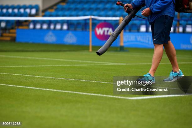 Grounds man tries to dry out court one after a long rain delay during Qualifying on Day 2 of The Aegon International Eastbourne on June 22, 2017 in...