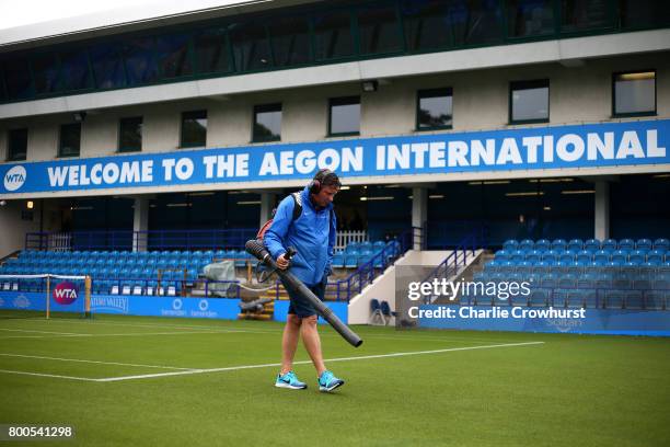 Grounds man tries to dry out court one after a long rain delay during Qualifying on Day 2 of The Aegon International Eastbourne on June 22, 2017 in...