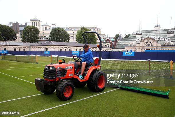 Grounds man tries to dry out the practice courts during Qualifying on Day 2 of The Aegon International Eastbourne on June 22, 2017 in Eastbourne,...