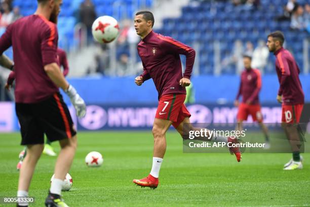 Portugal's forward Cristiano Ronaldo warms up ahead of the 2017 Confederations Cup group A football match between New Zealand and Portugal at the...