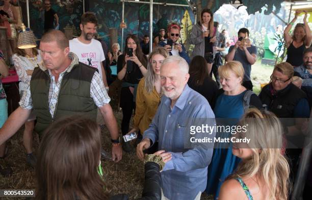 Labour Party leader Jeremy Corbyn meets festival goers as he visits the Green Fields at the Glastonbury Festival site at Worthy Farm in Pilton on...