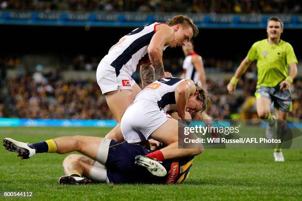 James Harmes and Jayden Hunt of the Demons wrestles with Luke Shuey of the Eaglesduring the round 14 AFL match between the West Coast Eagles and the...