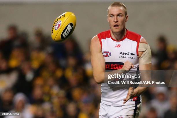 Tom McDonald of the Demons handpasses the ball during the round 14 AFL match between the West Coast Eagles and the Melbourne Demons at Domain Stadium...