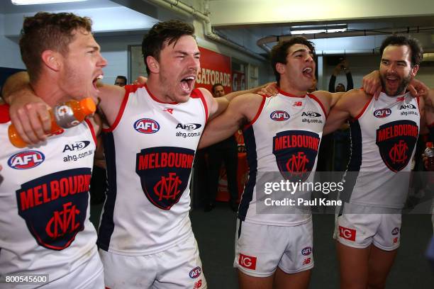 The Demons sing their club song after winning the round 14 AFL match between the West Coast Eagles and the Melbourne Demons at Domain Stadium on June...